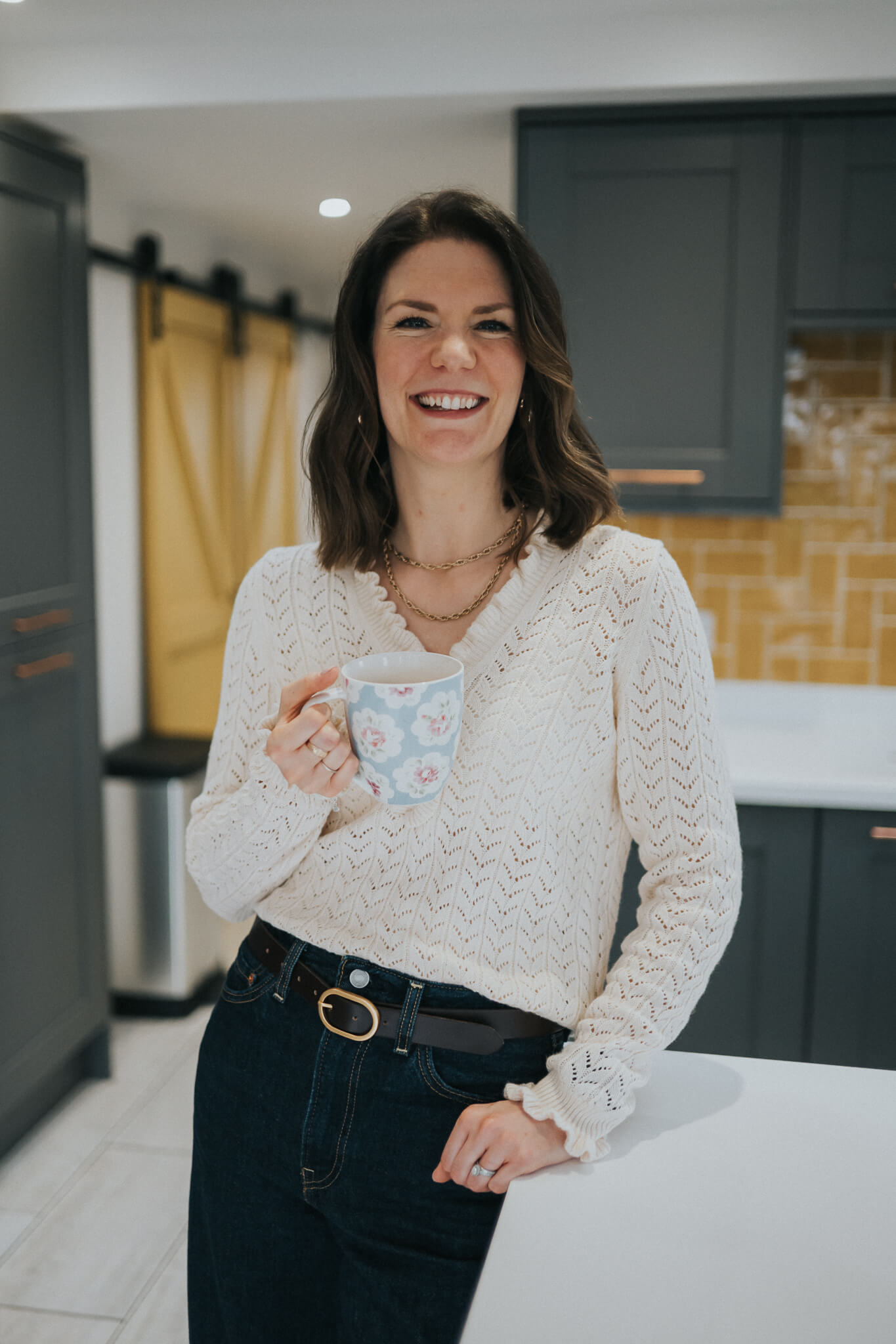 Michelle standing at home